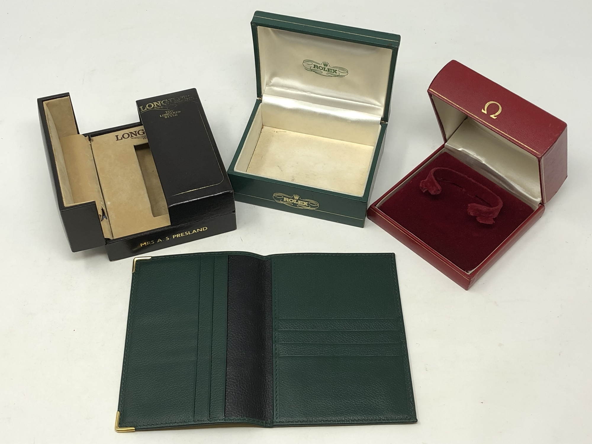 Three vintage wristwatch boxes; Rolex, Omega and Longines, plus a Rolex green leather wallet.