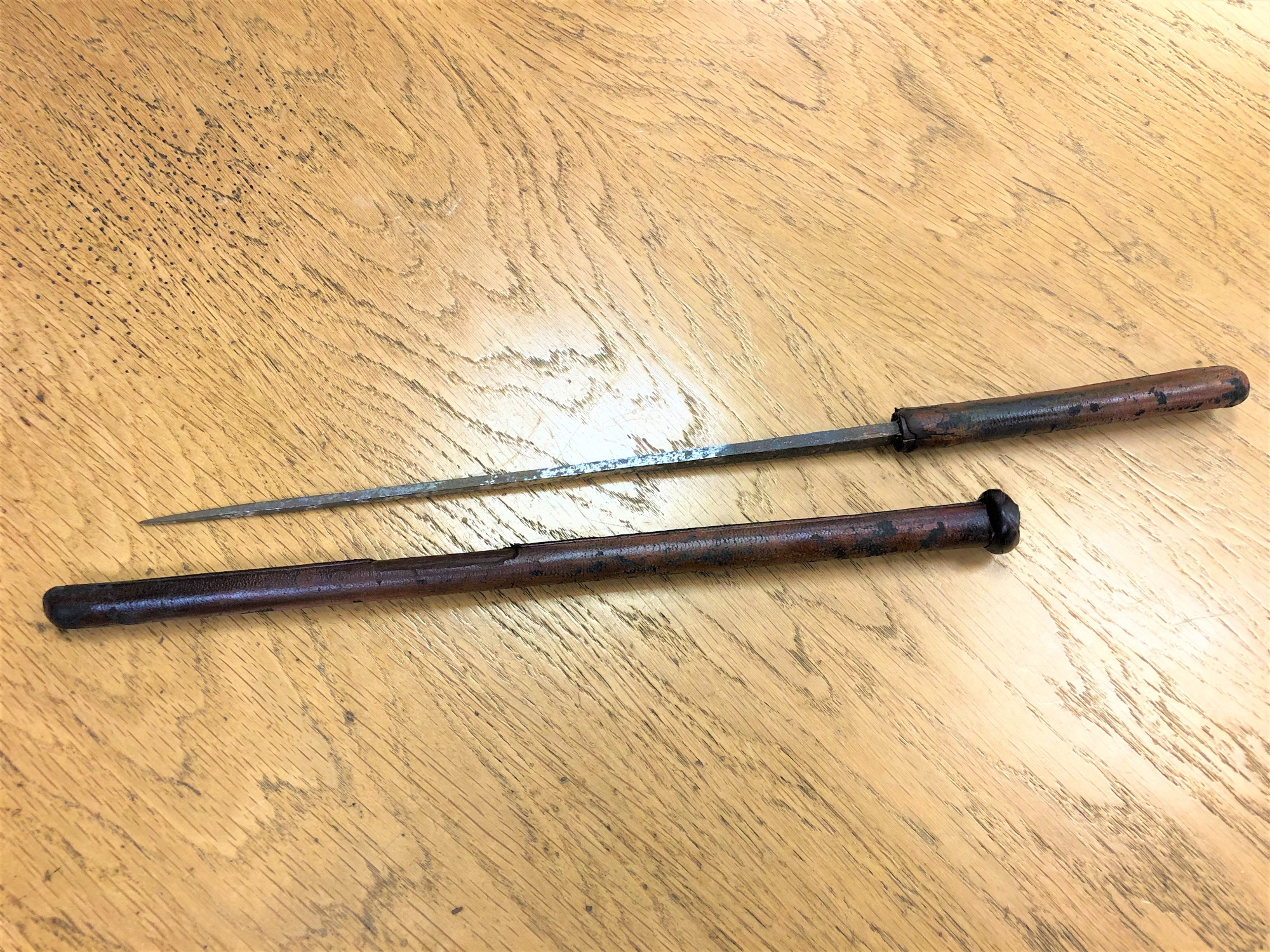 An unusual George V swagger stick/sword stick, bound in leather, length 56cm. * Property of Lt Cl.