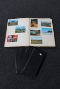 A scrap album containing 20th century tourist postcards, monochrome photographs,