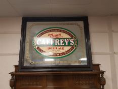 An antique and later overmantel mirror, with Thomas Caffrey's Irish Ale advertising,