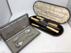 A Joseph Rogers & Sons cased five piece carving set with silver ferrules,