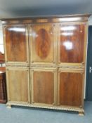 An Edwardian carved mahogany triple door wardrobe, width 191 cm,