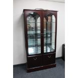 A contemporary mahogany double door display cabinet by Morris of Glasgow