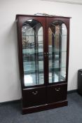 A contemporary mahogany double door display cabinet by Morris of Glasgow