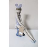 A retired Lladro figure 5162 'Mindy' in Mickey Mouse cap