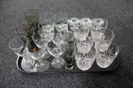 A tray of assorted glass ware, two-tone glass goblets, lead crystal glasses, candle holder,