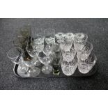A tray of assorted glass ware, two-tone glass goblets, lead crystal glasses, candle holder,