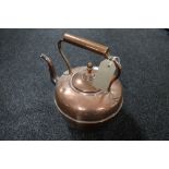 An antique copper kettle by Maurice Co.