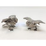 A pair of white metal figures of chicks, each stamped 925 Sterling, 182.6g gross, height 5.5cm.