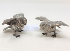 A pair of white metal figures of chicks, each stamped 925 Sterling, 182.6g gross, height 5.5cm.