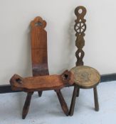 A rustic pine spinning chair together with a carved spinning chair
