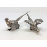 A pair of white metal figures of pheasants, each stamped 925 Sterling, largest 19cm long.