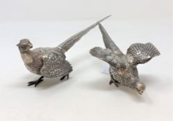 A pair of white metal figures of pheasants, each stamped 925 Sterling, largest 19cm long.