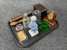 A tray of carved wooden spoon, continental boy figure, assorted glass ware including paperweights,