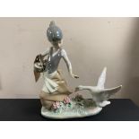 A Lladro figure - a girl feeding geese