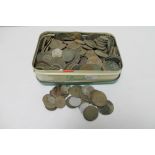 A tin of pre decimal British coins and foreign coins