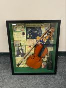 A framed violin montage, width 49.