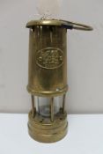 A brass Welsh miner's lamp