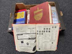 A box of stamp reference book and album of stamps,