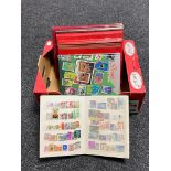 A box of six stamp albums containing twentieth century stamps of the world