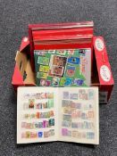 A box of six stamp albums containing twentieth century stamps of the world