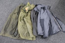 A box of black North Face jacket together with three Barbour jackets