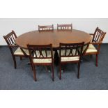 An inlaid mahogany Regency style twin pedestal dining table and six chairs