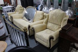 A three piece wood framed lounge suite in Regency green and gold fabric