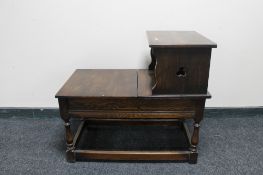 An early 20th century carved telephone table
