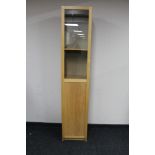 A contemporary sentry door display cabinet