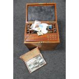 An early 20th century multi drawer mahogany dentist's chest with dental accessories