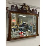 An antique mahogany framed Chippendale style mirror