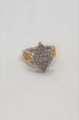 A yellow gold diamond cluster ring, approximately 1.25ct.