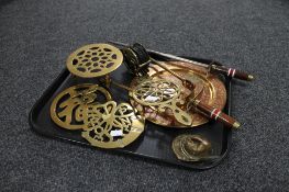 A tray of brass fireside accessories, sand coloured plate, fire tongs,