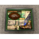 A framed rugby football montage,
