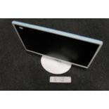 A Samsung model T24D391 EW HD TV monitor with lead and remote