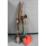 Four bundles of garden tools - rakes, edgers, fork,