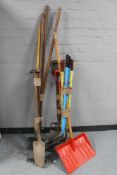 Four bundles of garden tools - rakes, edgers, fork,