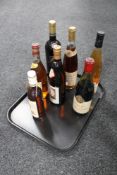 A tray of seven bottles of alcohol - Japanese Sake,