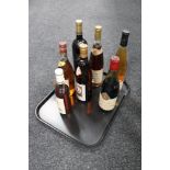 A tray of seven bottles of alcohol - Japanese Sake,