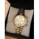 A stainless steel and gold plated Guess Nissan wristwatch