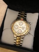 A stainless steel and gold plated Guess Nissan wristwatch