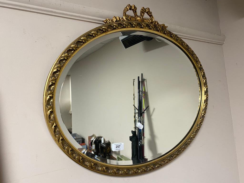 An ornate bevelled gilt framed mirror