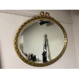 An ornate bevelled gilt framed mirror