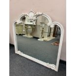 A contemporary cream framed mirror in distressed finish,