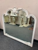 A contemporary cream framed mirror in distressed finish,