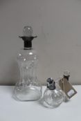 A glass decanter with silver collar together a twin glass oil dispenser with silver collar