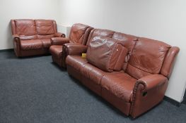 A tan leather four piece lounge suite : four seater settee, two seater,