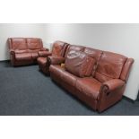 A tan leather four piece lounge suite : four seater settee, two seater,