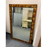 An inlaid rectangular bevelled mirror, with parquetry inlaid frame,